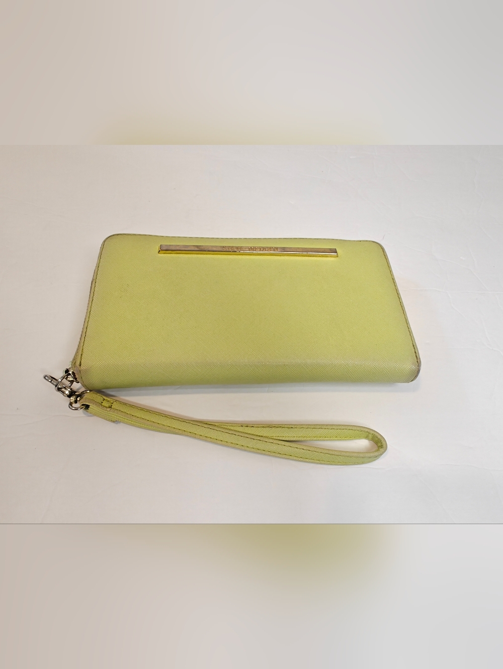 The Steve Madden BZIPPY Lemon Yellow Zip All Around Wallet Wristlet is a stylish